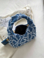 sac bleu brodee effilochee en jeans ouverture fermeture eclair